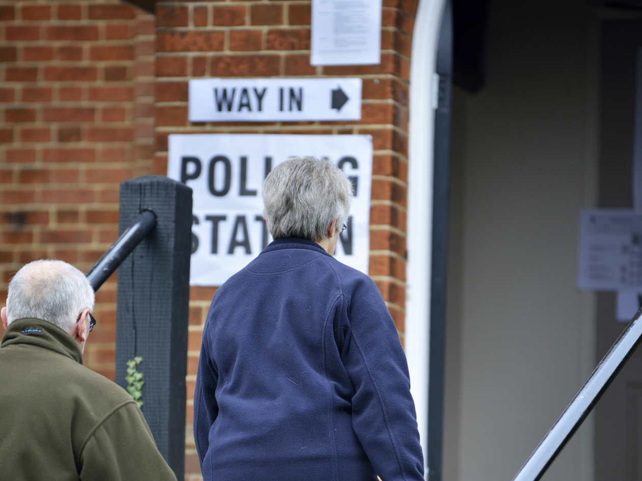 people entering a polling station