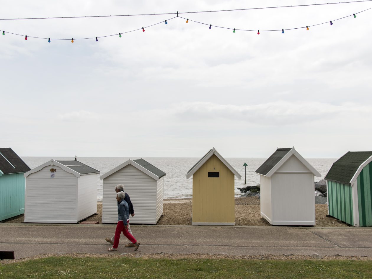 people walking on a seafront