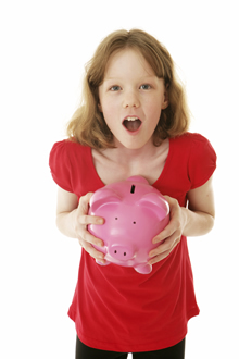 Girl holding piggy bank